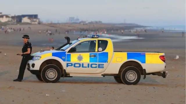 A police patrol on Camber Sands on the day five men died