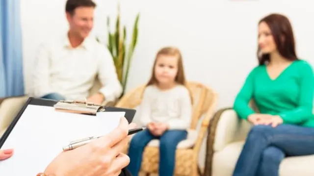 Child and family with doctor