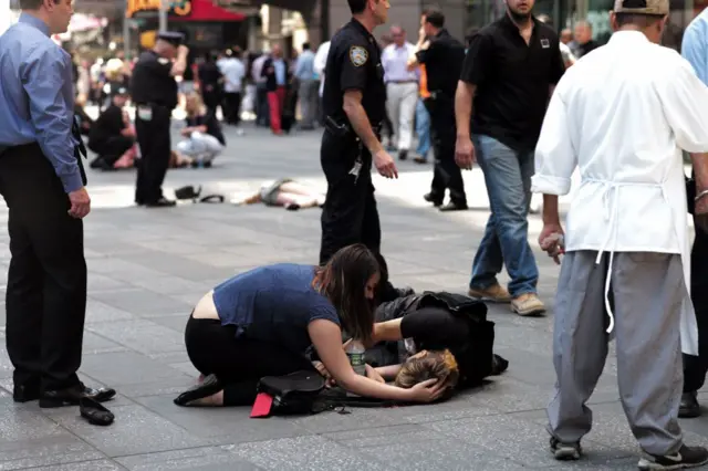 New Yorkers treat a wounded pedestrian