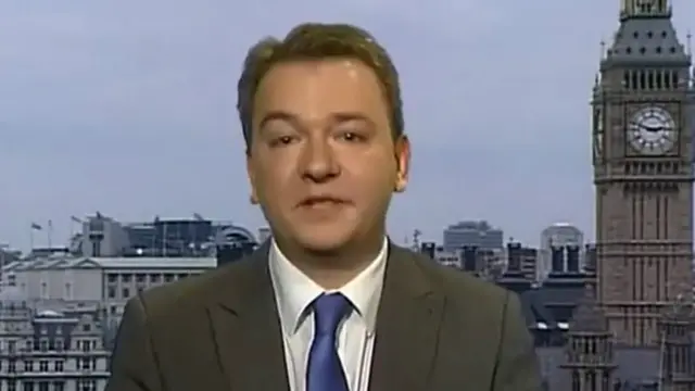 Tim Akers in BBC studio, with Big Ben and London skyline behind