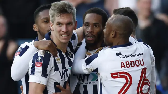 Millwall celebrate scoring against Leicester