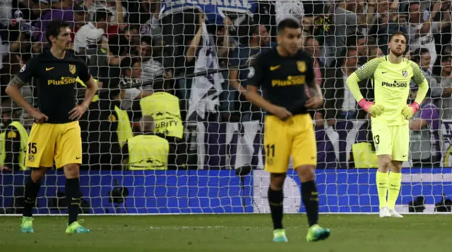 Atletico Madrid players look dejected