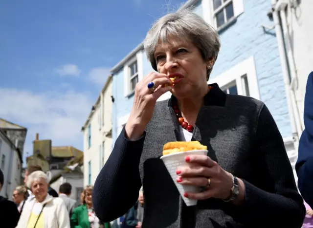 Theresa May eating chips