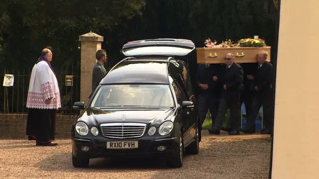 Funeral cortege at the church