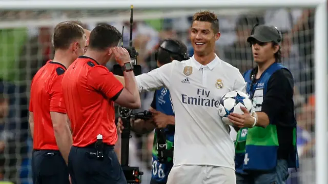 Cristiano Ronaldo with referee Martin Atkinson