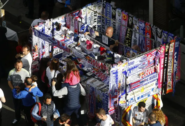 General view of a scarf seller outside the stadium