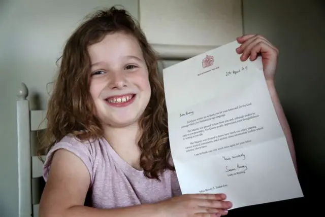 Briony Tinker-Ives with her letter from the Queen.