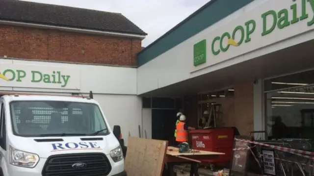 Damaged Co-op shop front