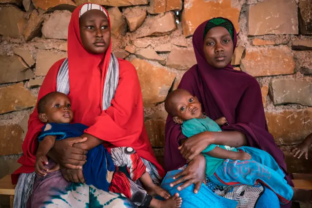 Young mothers wait with their children to be seen at a UNICEF-supported outpatient therapeutic center in Garbaharey, Somalia, Wednesday, April 5, 2017. UNICEF/Mackenzie Knowles-Coursin