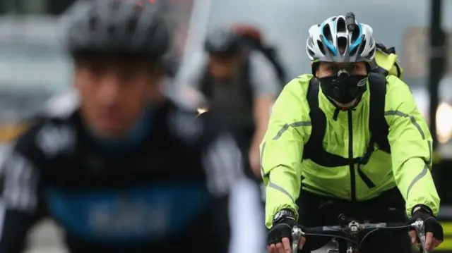 Cyclist wearing mask