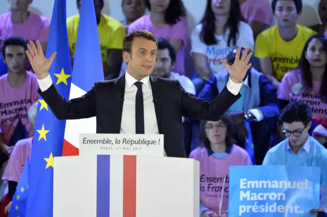 Emmanuel Macron addresses voters during a political meeting at Grande Halle de La Villette on 1 May