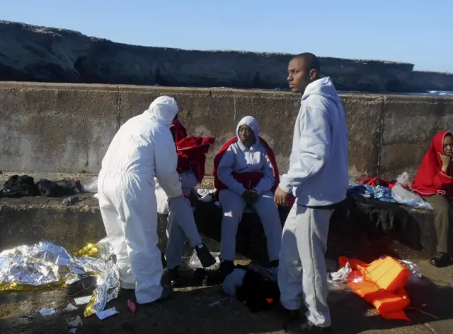 Migrants rescued at sea being attended by emergency services in Isla de Alboran, Spain, April 2017