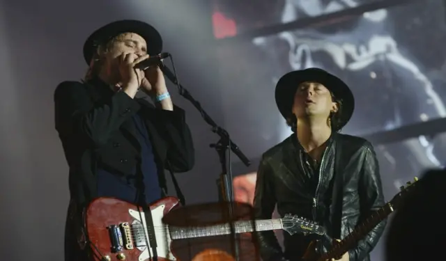 Pete Doherty and Carl Barat performing with the remainder of The Libertines in 2015