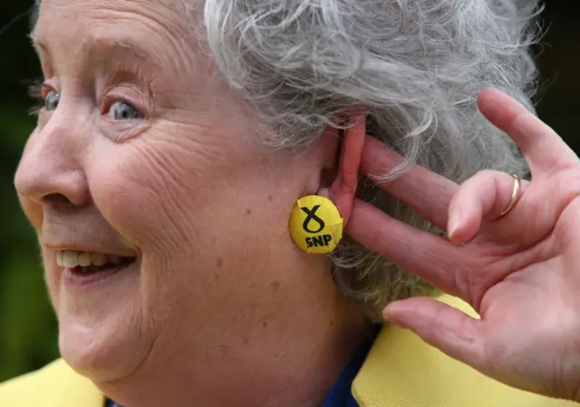 SNP supporter shows off her earring