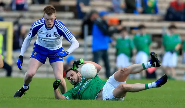 Ryan McAnespie (left) battles with Fermanagh's Paul McCusker