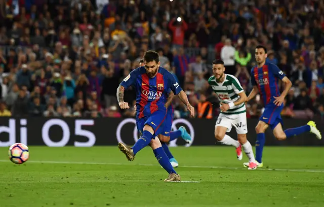 Lionel Messi of Barcelona scores a penalty