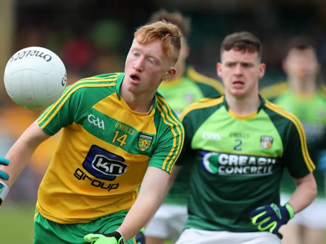 Donegal's Oisin Gallan in action against Antrim's Eamon Kelly.