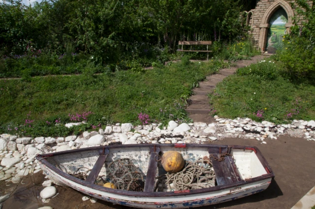 Boat and archway in the garden