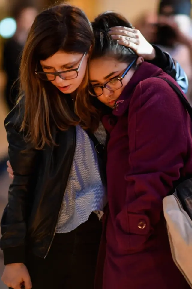 Members of the public attend a candlelit vigil at Albert Square in Manchester, 23 May