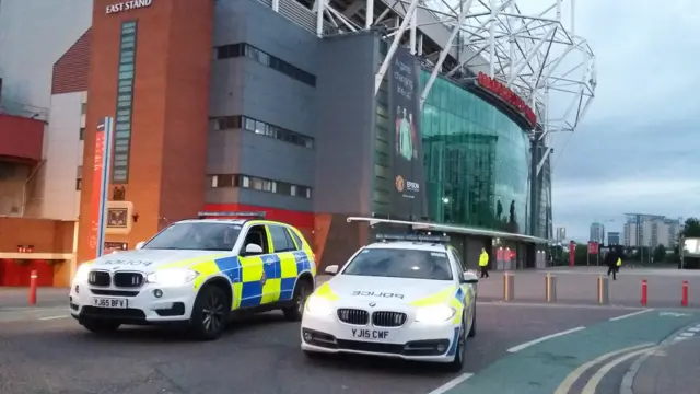 Police cars outside Old Trafford stadium