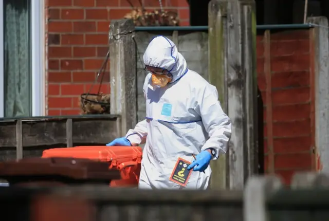 A police forensic investigator at an address in Elsmore Road