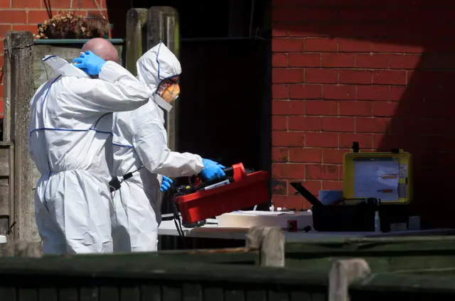 Forensic investigators at Elsmore Road, Fallowfield, where a controlled explosion took place