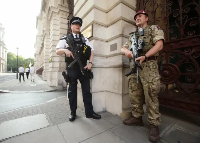 Policeman and soldier outside FCO