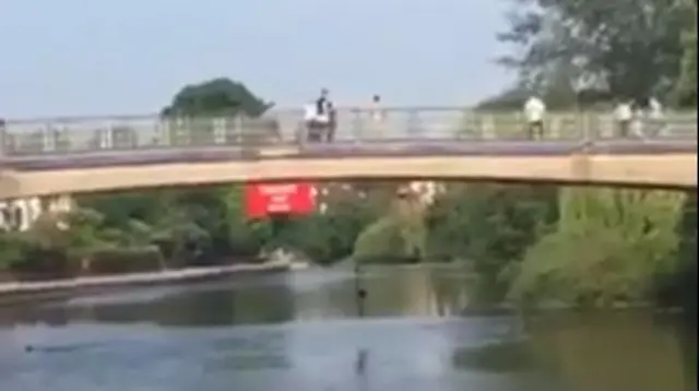 Boy jumping in river