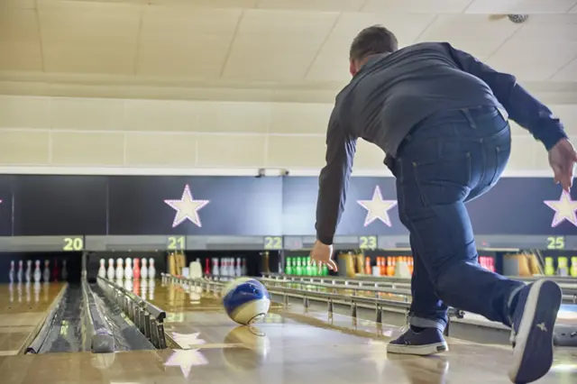 A man bowling