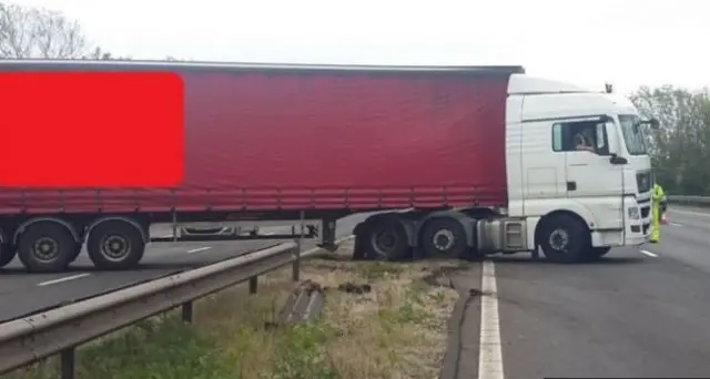 Lorry through central reservation