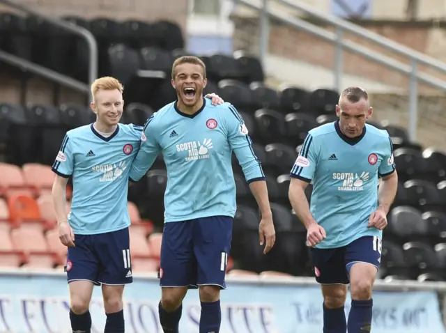 Carlton Morris (centre) celebrates scoring for Hamilton against Dundee United