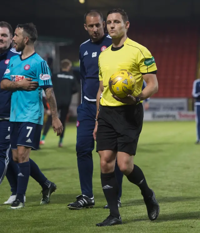 Referee Steven McLean leaves the field