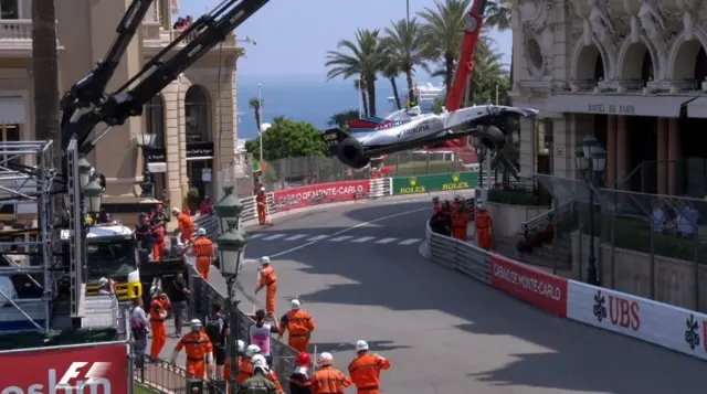 Stroll's car is lifted off the track