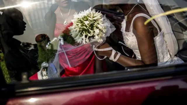 Bride covering her face