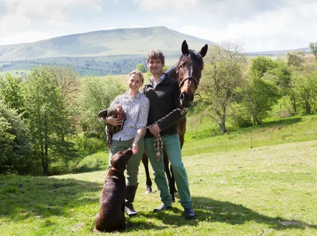 Hay vets Hannah and Barney Sampson with their horse, rooster and labrador.