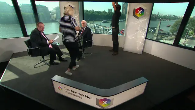 Andrew Neil and Jeremy Corbyn preparing for interview