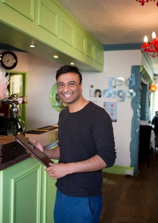 Eklim Khan stands in the Red Indigo restaurant in Hay-on-Wye