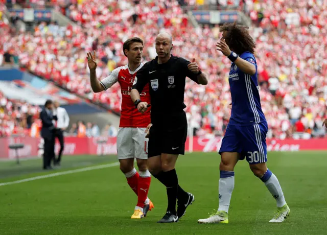 Nacho Monreal, Anthony Taylor and David Luiz