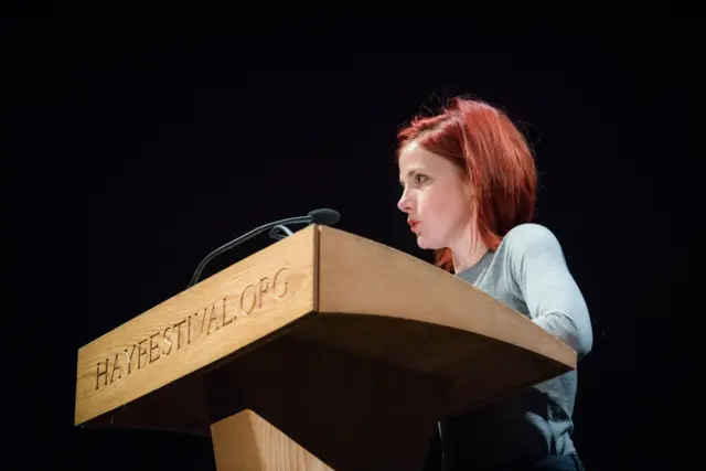 Louise Brealey reads a letter at the Hay Festival