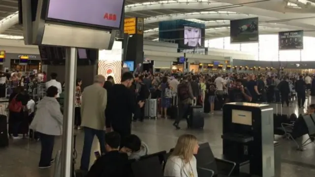 passengers wait at heathrow terminal 5