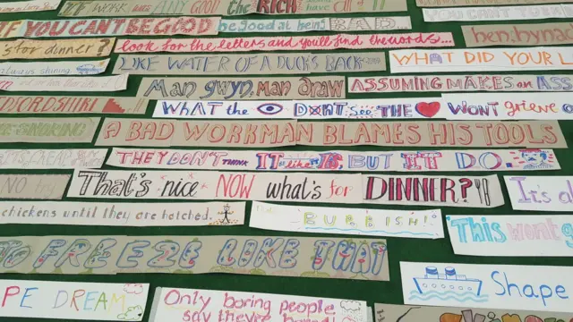 Phrases written on strips of paper