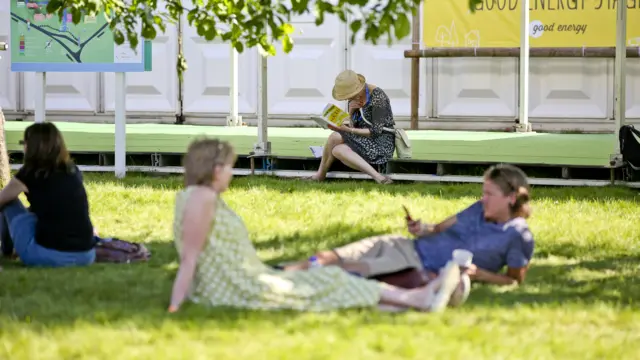 Woman reading a book in the sunshine