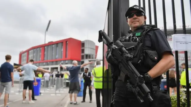 Armed officer at Manchester's Old Trafford cricket ground