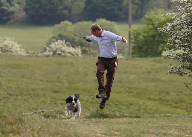 Liberal Democrats leader Tim Farron and his 5-year-old Springer Spaniel Jasper during a walkabout with the media in Scout Scar, in the Lake District