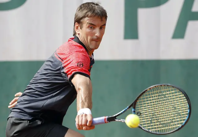 Tommy Robredo of Spain plays a backhand