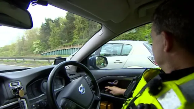 Policeman in car