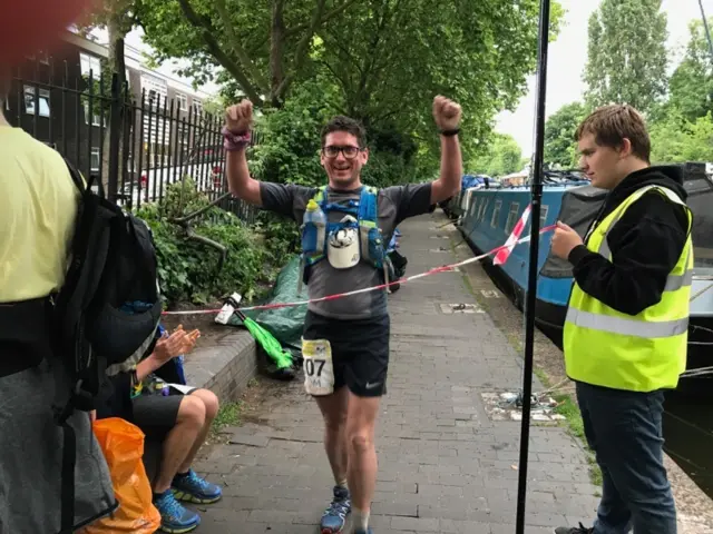 Tom Boother crosses the finish line