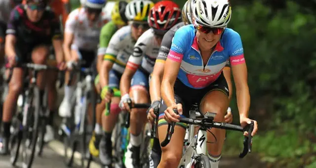 Women cycling towards camera