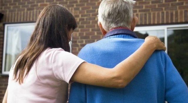 Carer with elderly man