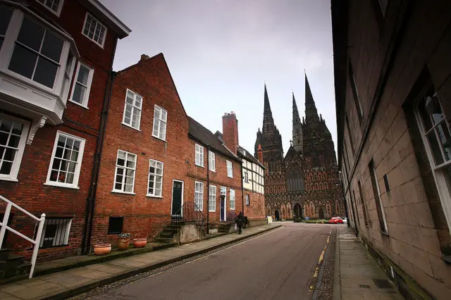 Generic image of cathedral behind city streets